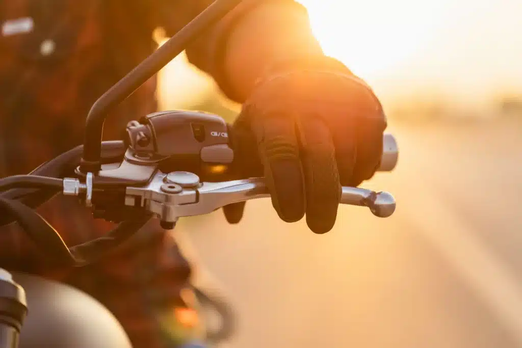 motorcyclist with fingers on breaks